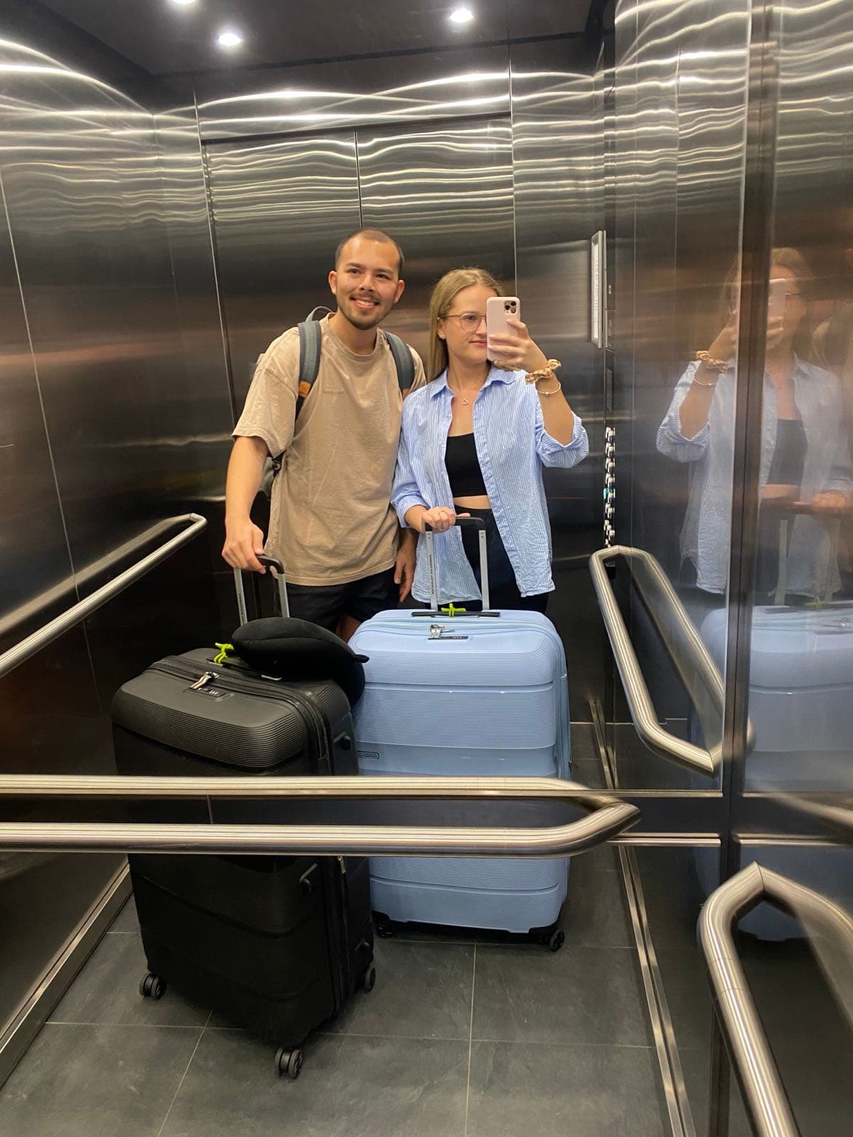 Jessie and Sean with their suitcases at the airport before their first overseas trip